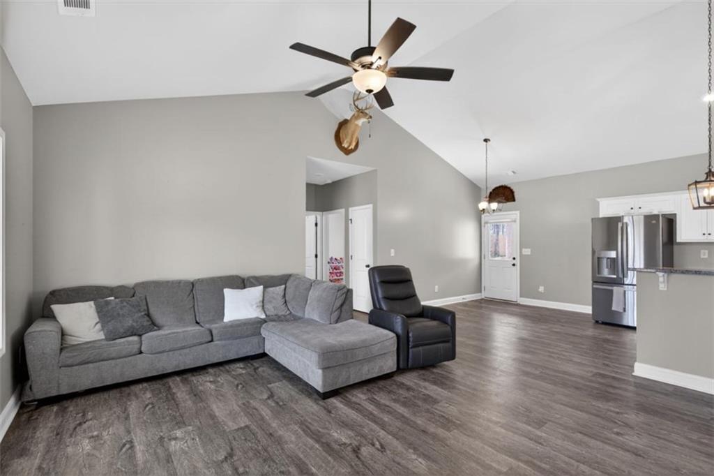 184 King Farm Road Rockmart, GA 30153 - Photo 4 of 25 a living room with furniture ceiling fan and a wooden floor
