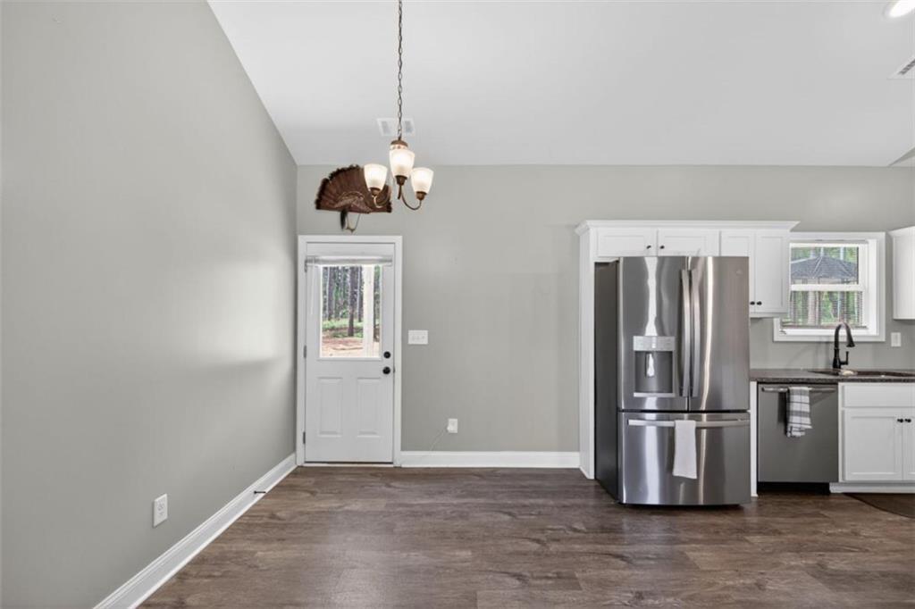 184 King Farm Road Rockmart, GA 30153 - Photo 6 of 25 a kitchen with stainless steel appliances a refrigerator and a stove top oven