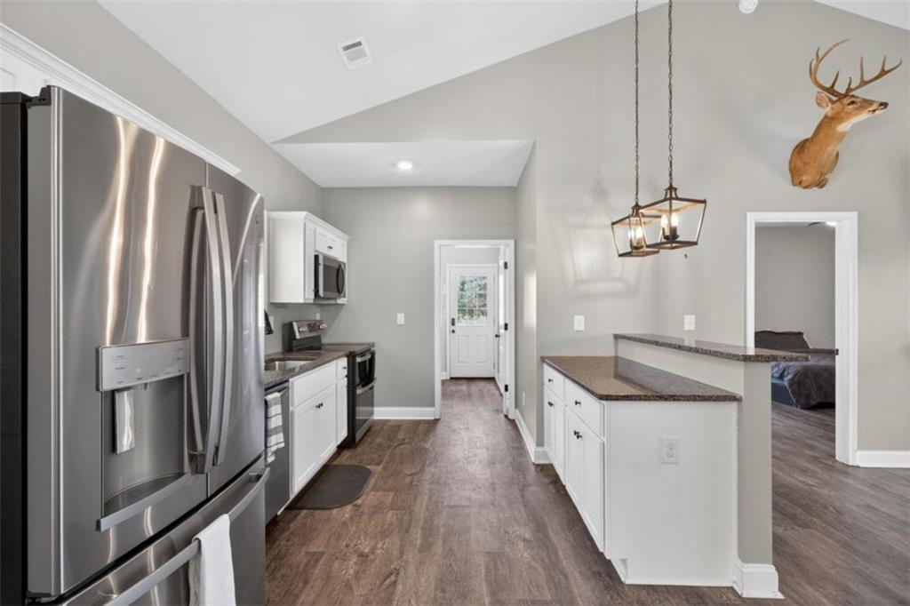 184 King Farm Road Rockmart, GA 30153 - Photo 7 of 25 a kitchen with a refrigerator a sink and dishwasher