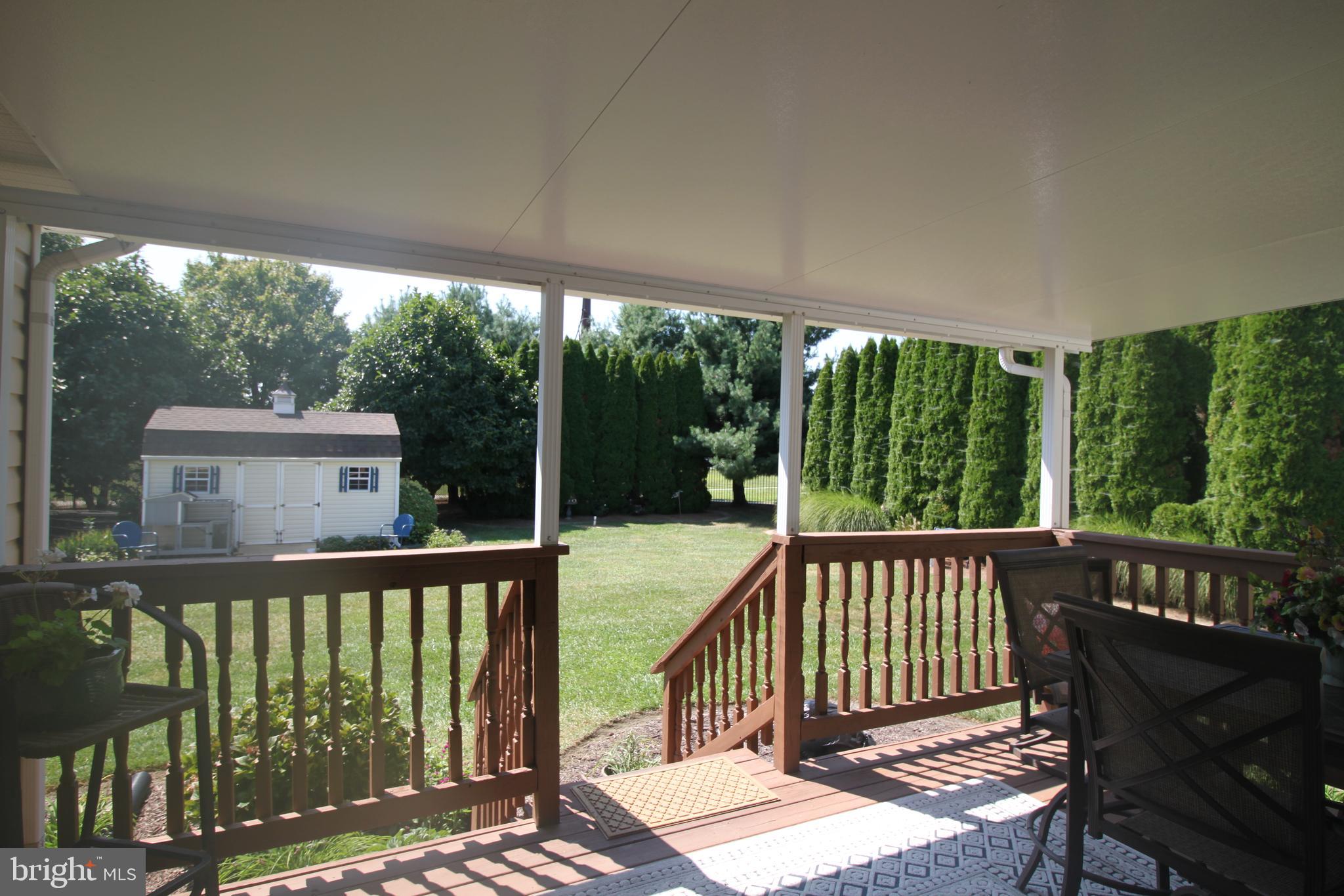 1622 Forrest Avenue Dover, DE 19904 - Photo 10 of 37 back deck with awning overlooking backyard