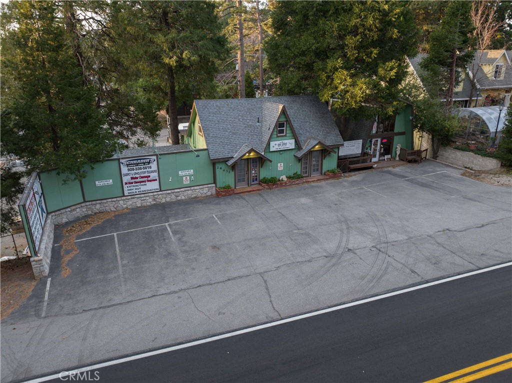 26432 Pine Avenue Rimforest, CA 92378 - Photo 1 of 1 a view of a house with backyard and sitting area