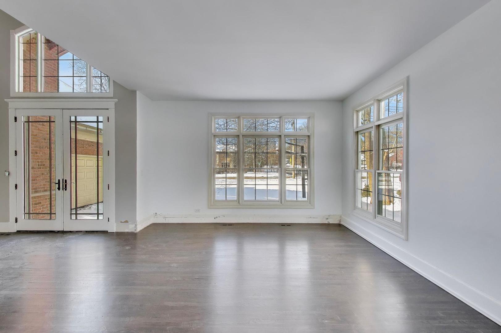 309 Ridge Road Highland Park, IL 60035 - Photo 11 of 71 a view of an empty room with wooden floor and a window