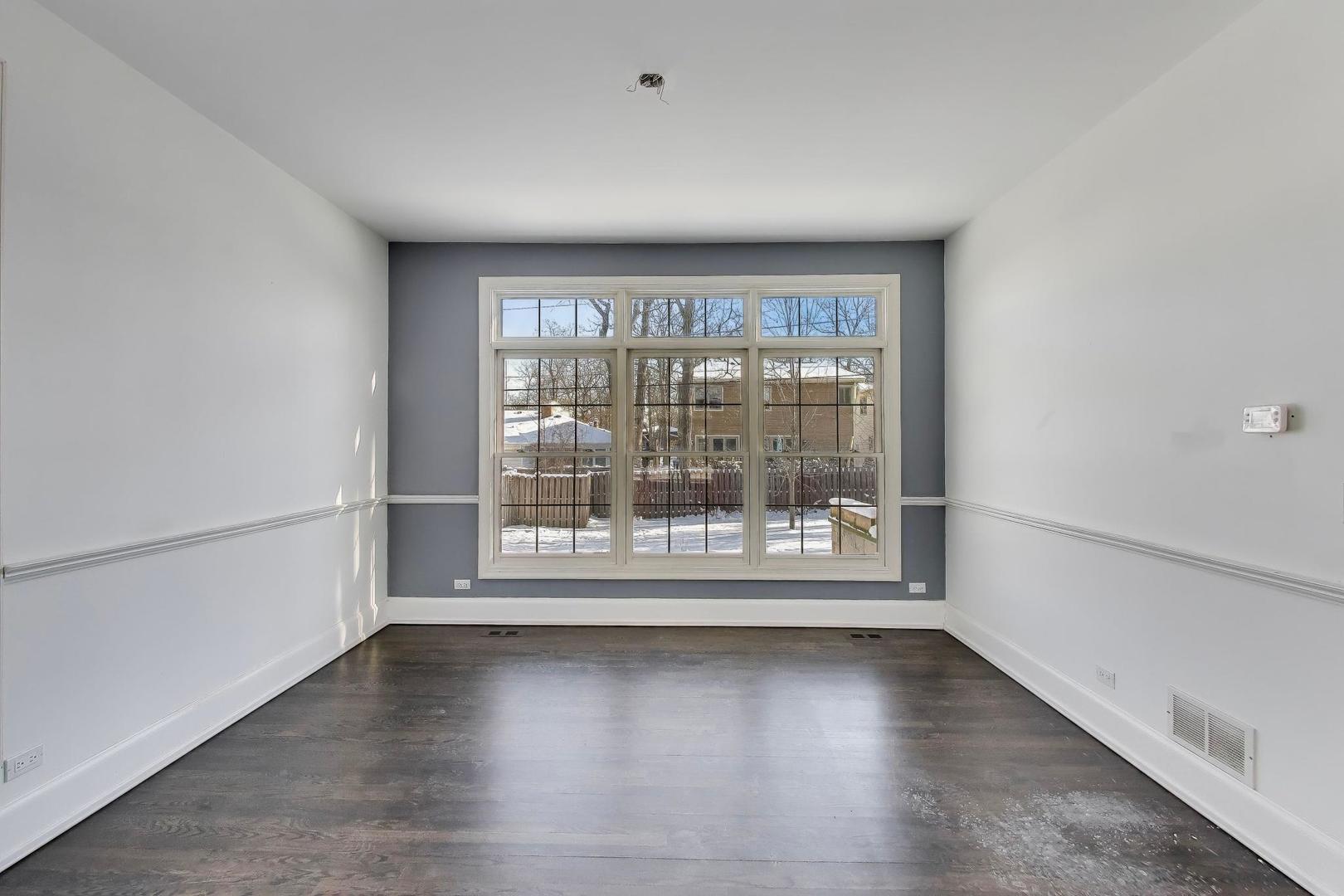 309 Ridge Road Highland Park, IL 60035 - Photo 13 of 71 a view of empty room with wooden floor and fan