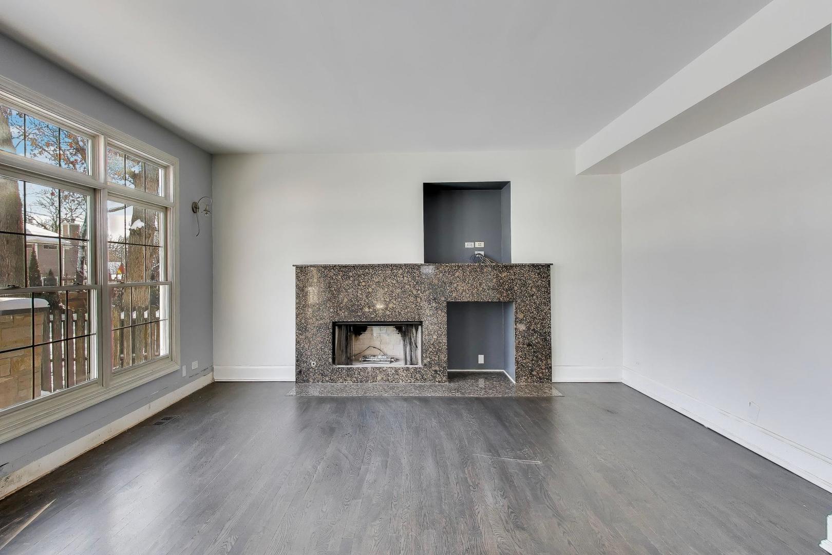 309 Ridge Road Highland Park, IL 60035 - Photo 19 of 71 a living room with a fireplace and wooden floor