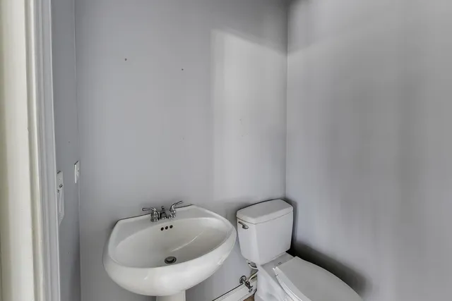 a spacious bathroom with a granite countertop sink and a mirror