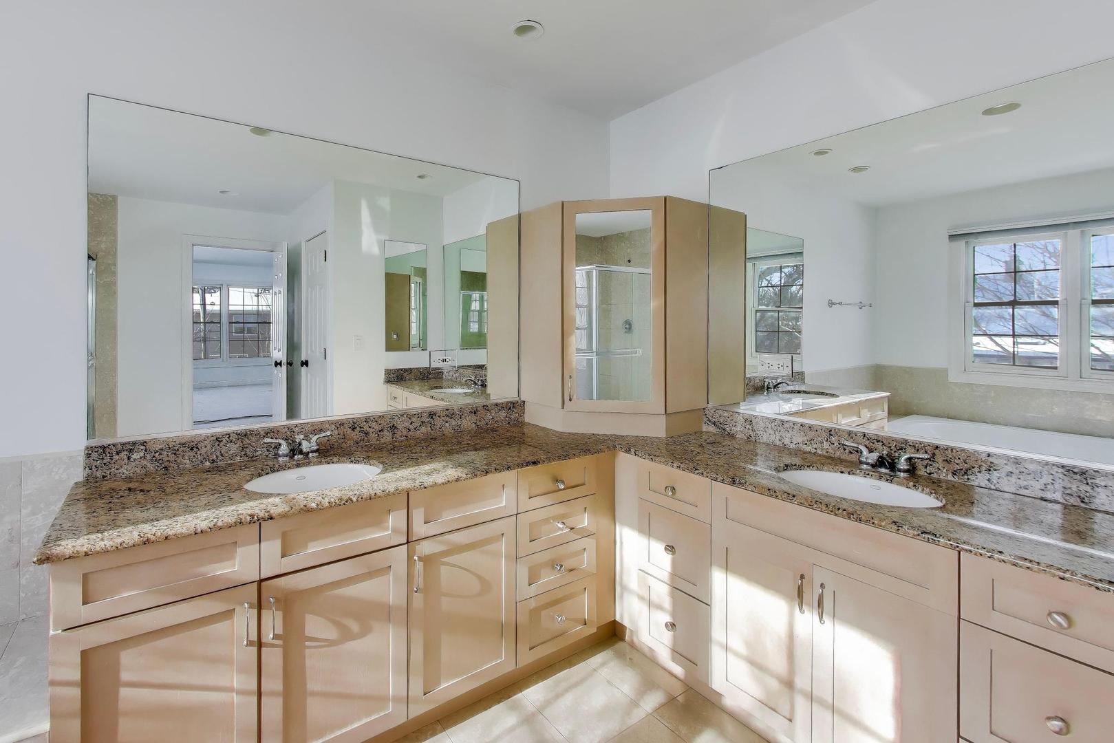 309 Ridge Road Highland Park, IL 60035 - Photo 37 of 71 a bathroom with a granite countertop sink and a mirror