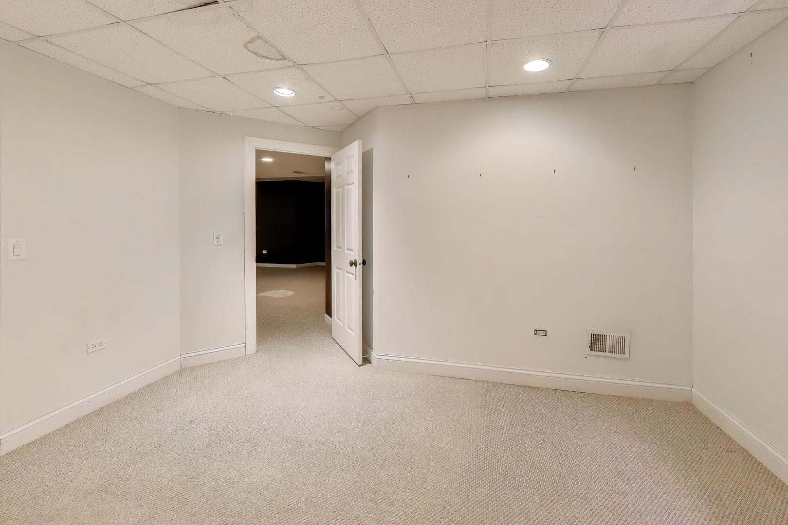 309 Ridge Road Highland Park, IL 60035 - Photo 58 of 71 an empty room with an entryway and closet