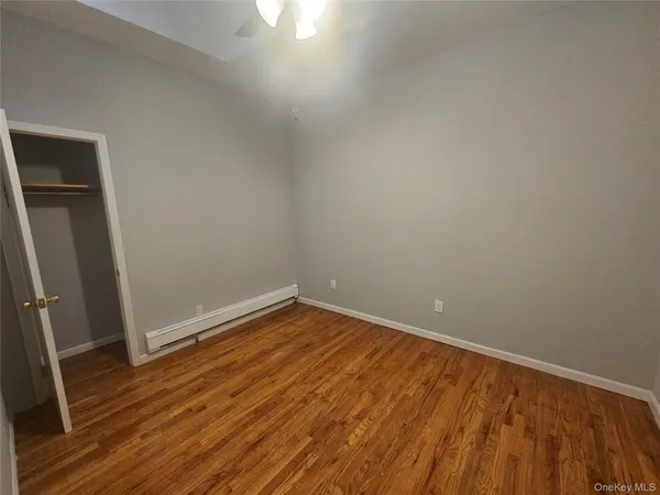 a bathroom with a shower a toilet and sink