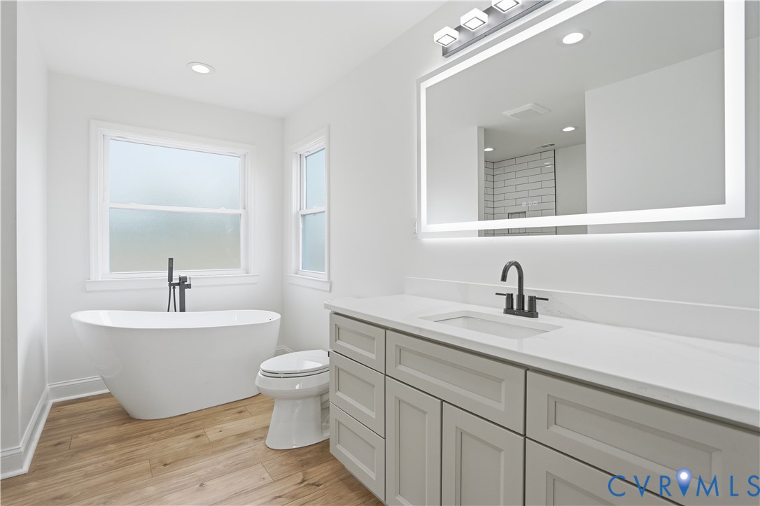 7839 King William Road Aylett, VA 23009 - Photo 20 of 38 a bathroom with a toilet sink and mirror