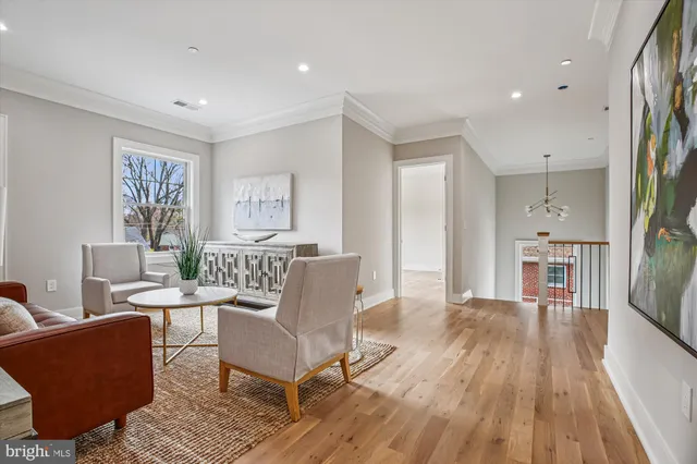 a spacious bathroom with a granite countertop sink a mirror a bathtub and shower