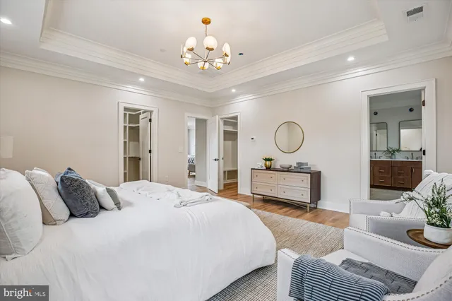 a view of a room with wooden floor and bathroom
