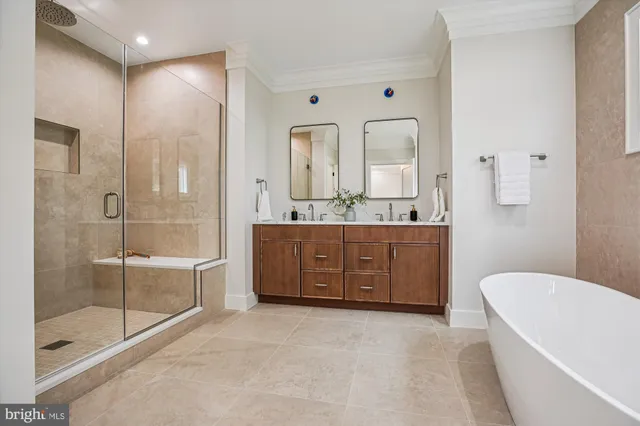 a view of a room with wooden floor and white walls