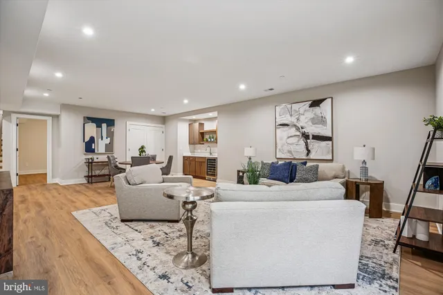 a front view of a house with a garden and yard