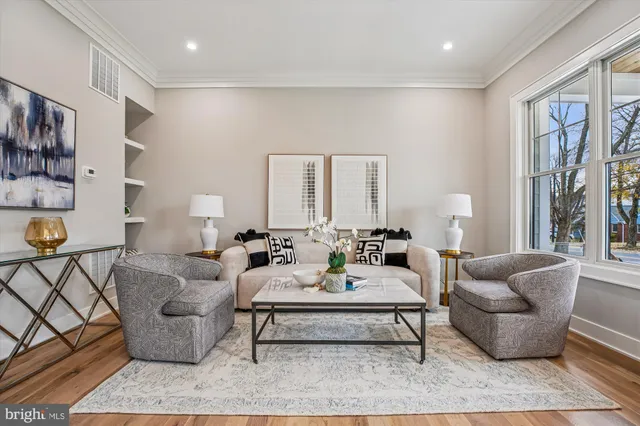 a dining room with wooden floor and a chandelier