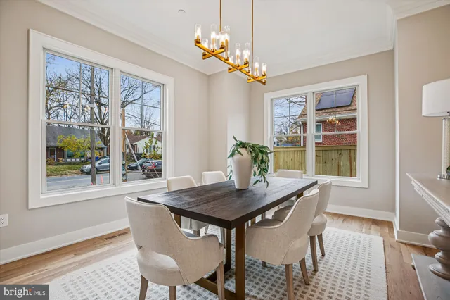 a large kitchen with stainless steel appliances kitchen island a large counter top a sink a stove and a refrigerator