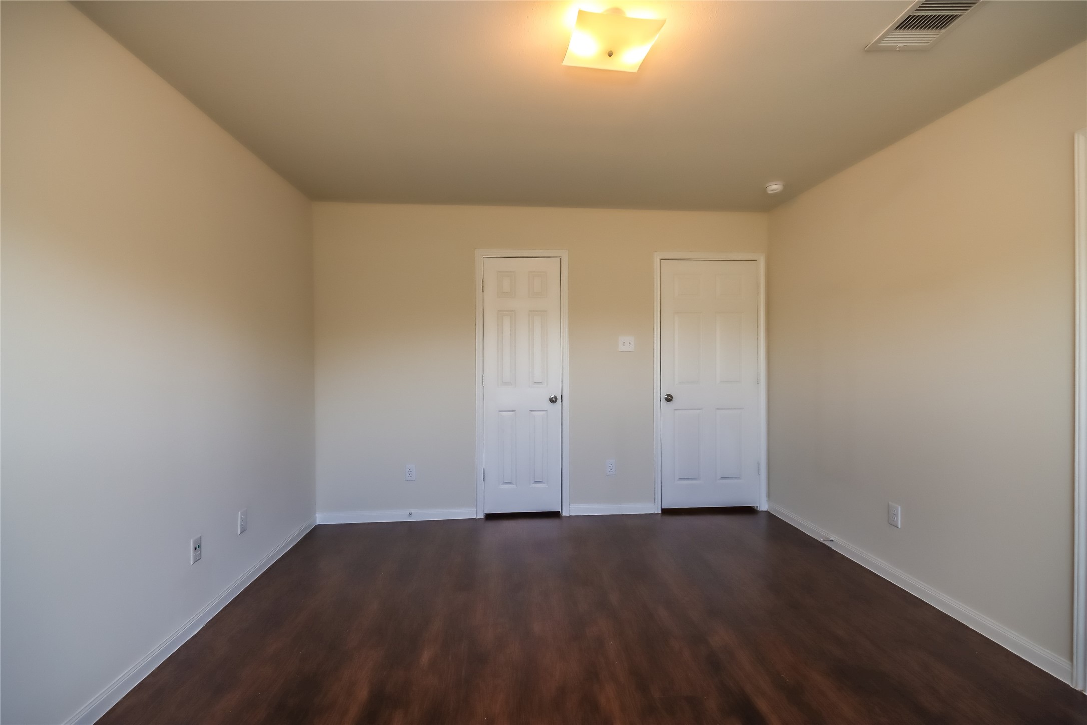 13022 Ristina Circle Houston, TX 77048 - Photo 11 of 15 an empty room with wooden floor and windows