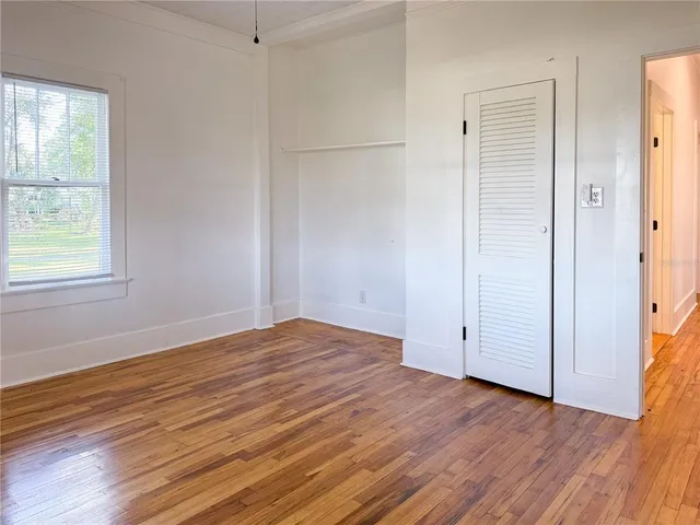 a view of a porch with a table and chairs