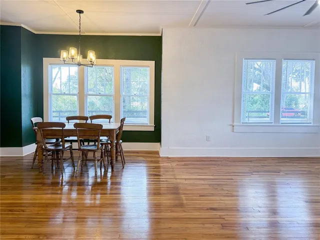 a living room with furniture and large window