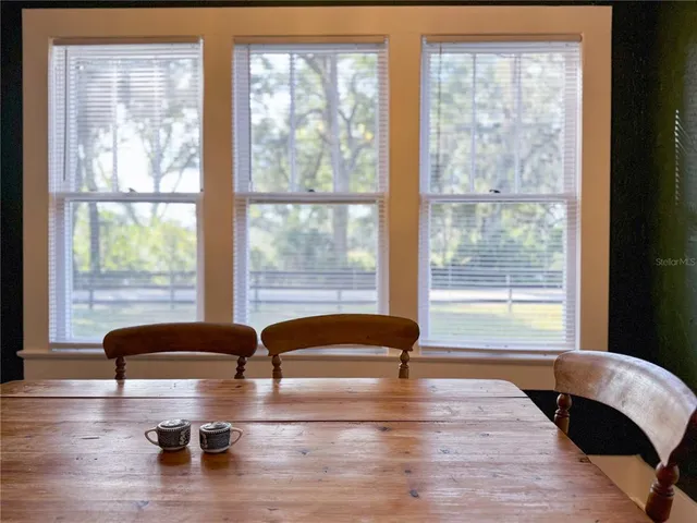 a kitchen with stainless steel appliances white cabinets a sink and a stove
