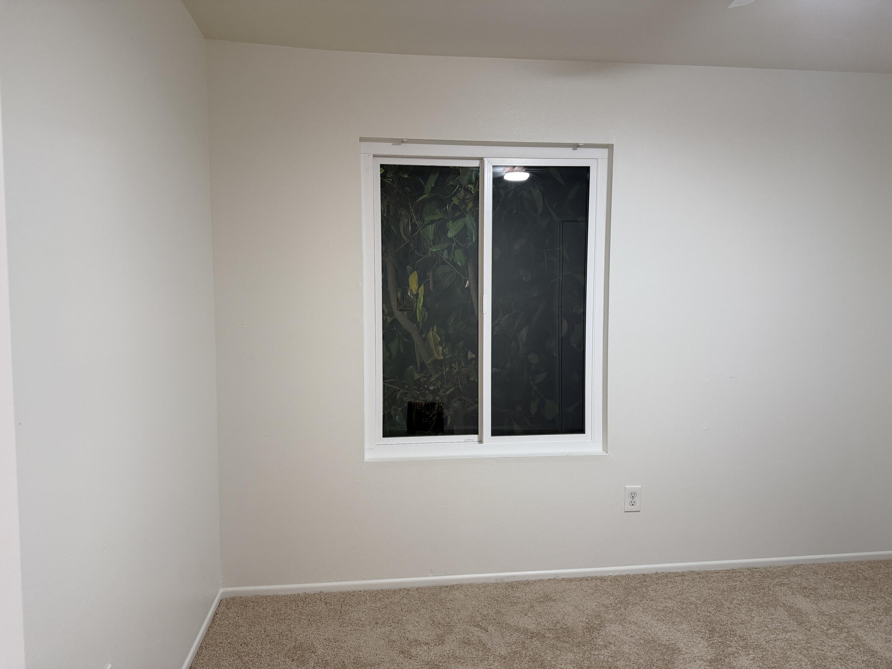 82567 Ave 48, Unit 36 Indio, CA 92201 - Photo 23 of 27 a view of an empty room with a window