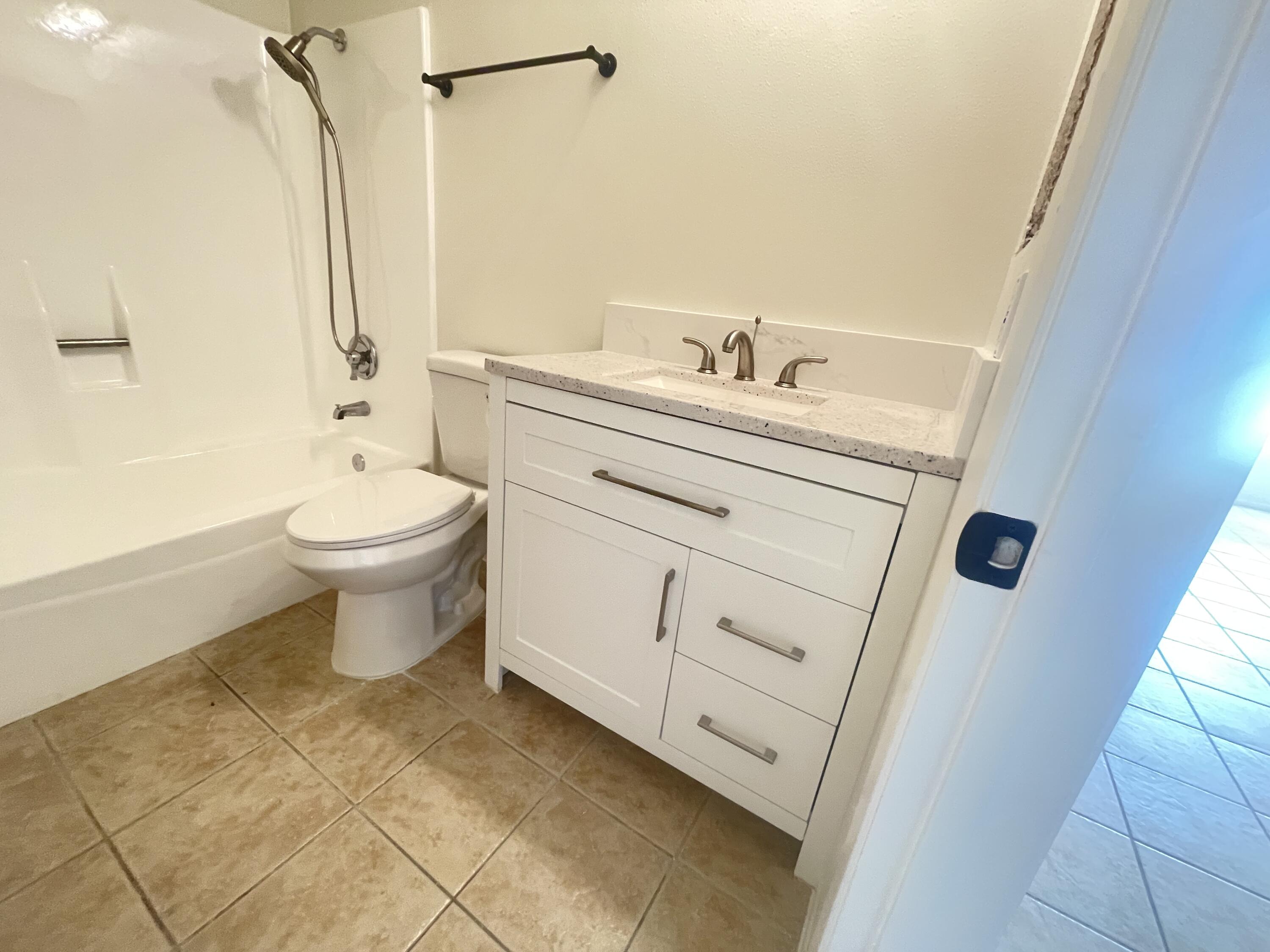 82567 Ave 48, Unit 36 Indio, CA 92201 - Photo 3 of 27 a bathroom with a sink a toilet and shower