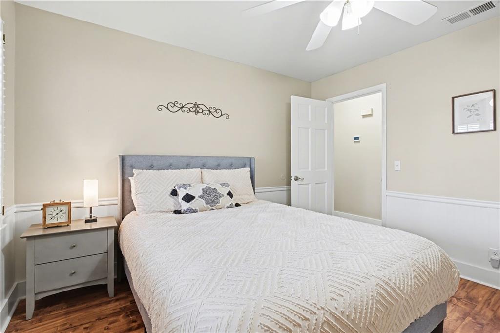 1833 Tom Odum Road Vidalia, GA 30474 - Photo 28 of 59 a bedroom with a bed and a cabinets