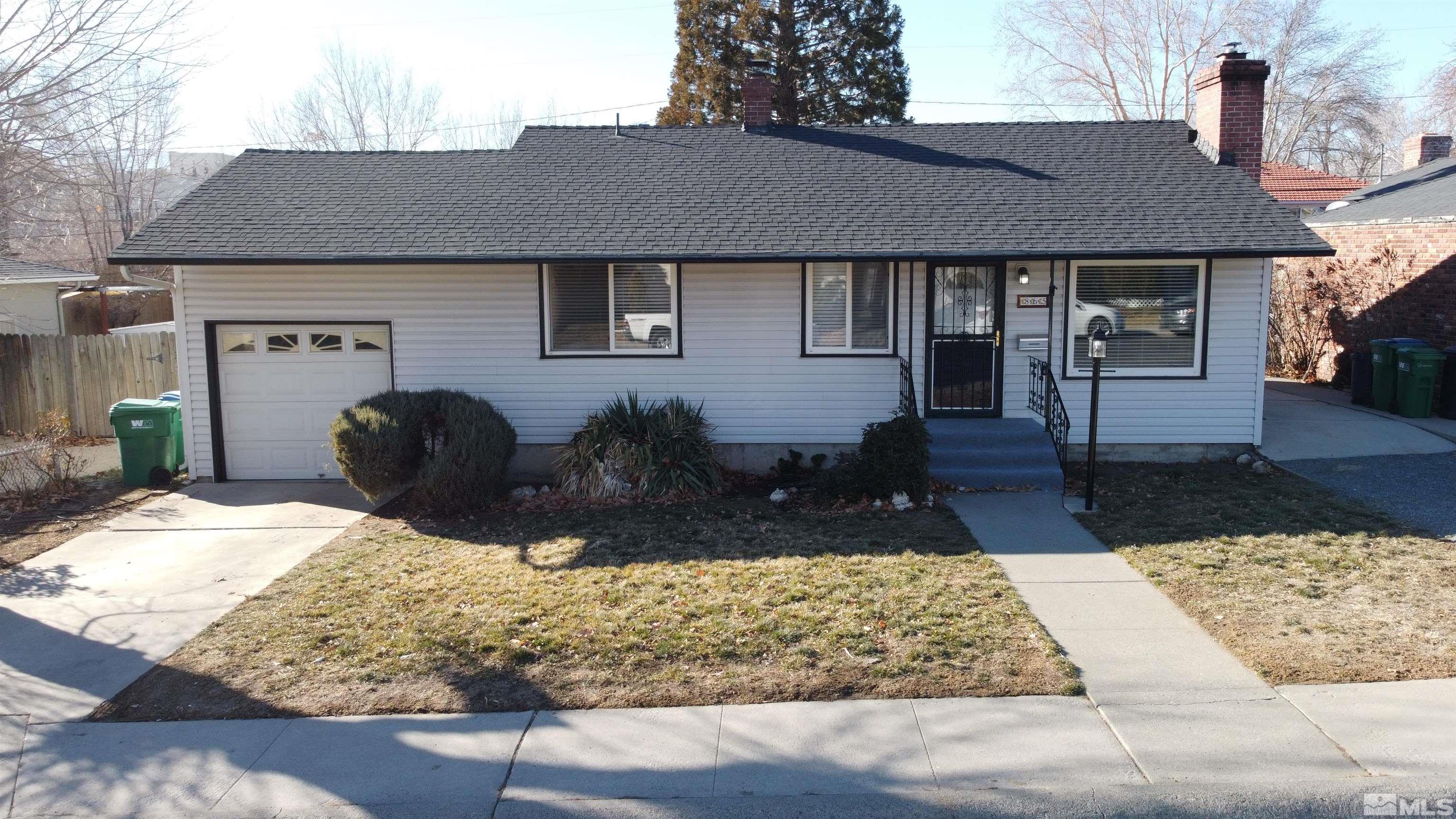 865 Wilkinson Avenue Reno, NV 89502 - Photo 2 of 36 a front view of a house with garden