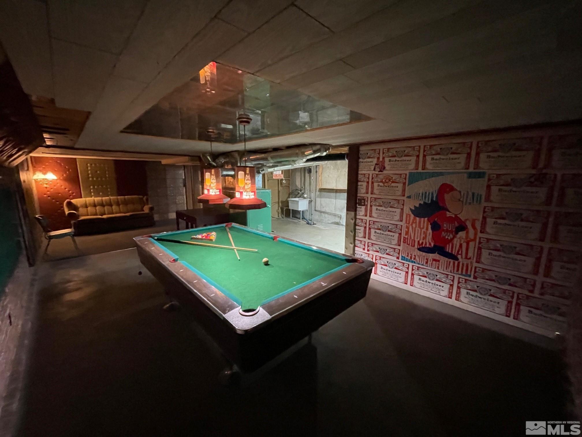 865 Wilkinson Avenue Reno, NV 89502 - Photo 22 of 36 a room with pool table a flat screen tv and outdoor seating