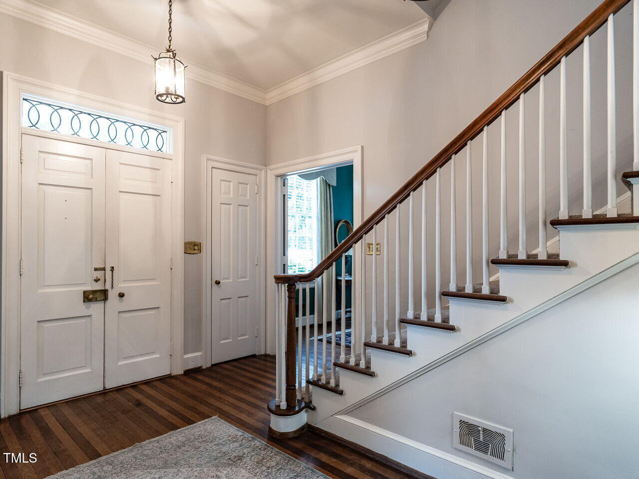 1930 Reid Street Raleigh, NC 27608 - Photo 3 of 31 a view of an entryway with wooden floor and staircase