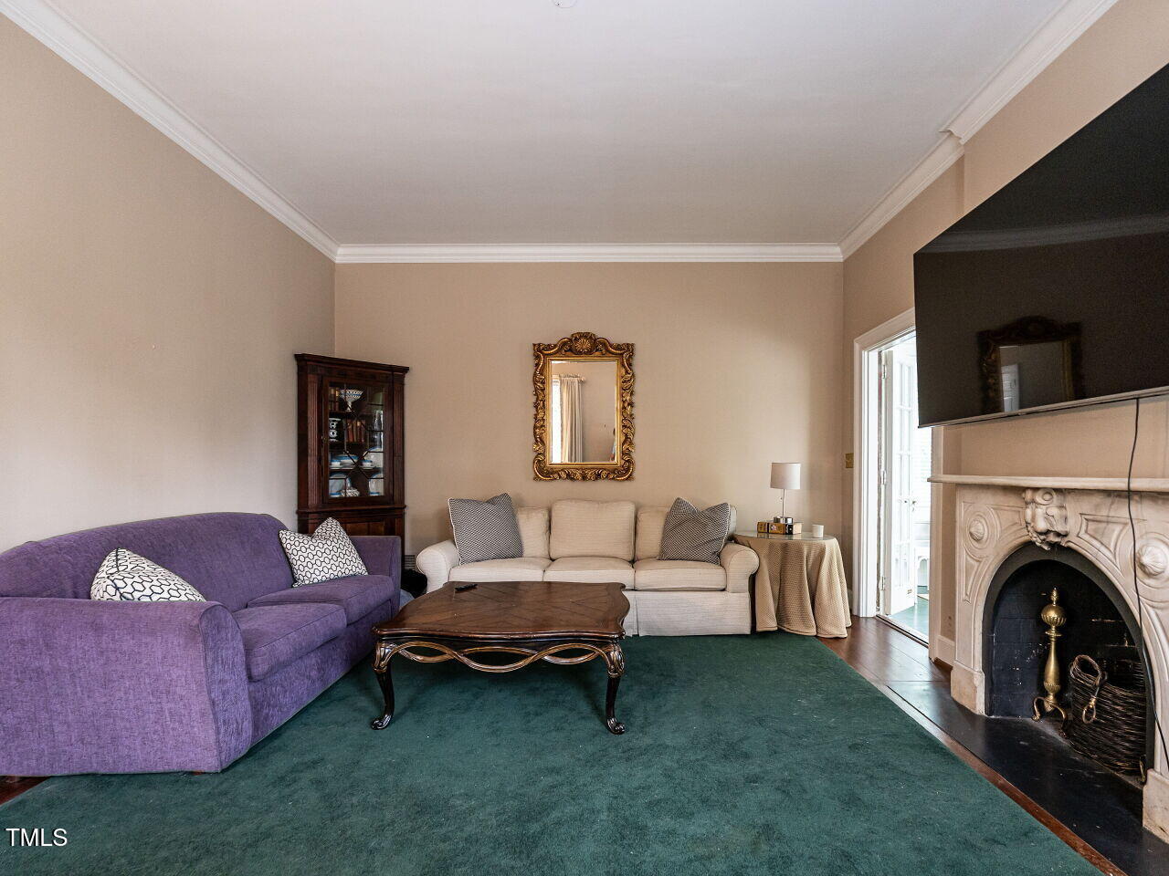 1930 Reid Street Raleigh, NC 27608 - Photo 6 of 31 a living room with furniture and a fireplace