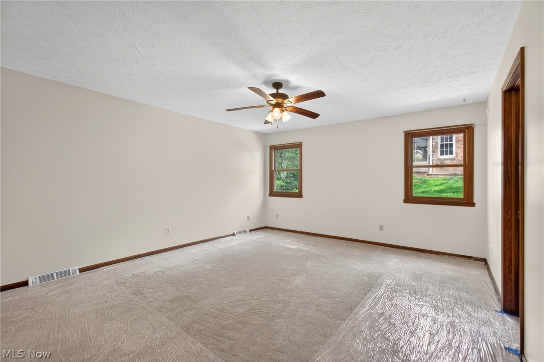 5346 Burlawn Street Northwest Canton, OH 44708 - Photo 15 of 40 Spacious room featuring neutral wall tones, and plush carpeting