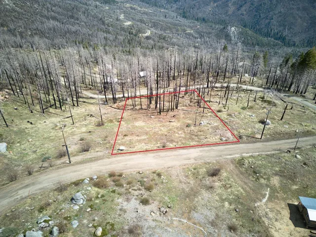 a view of yard with wooden fence