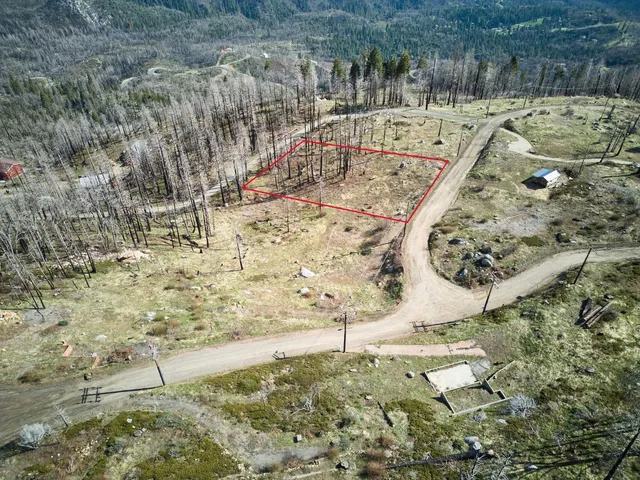 a view of a swimming pool with a yard