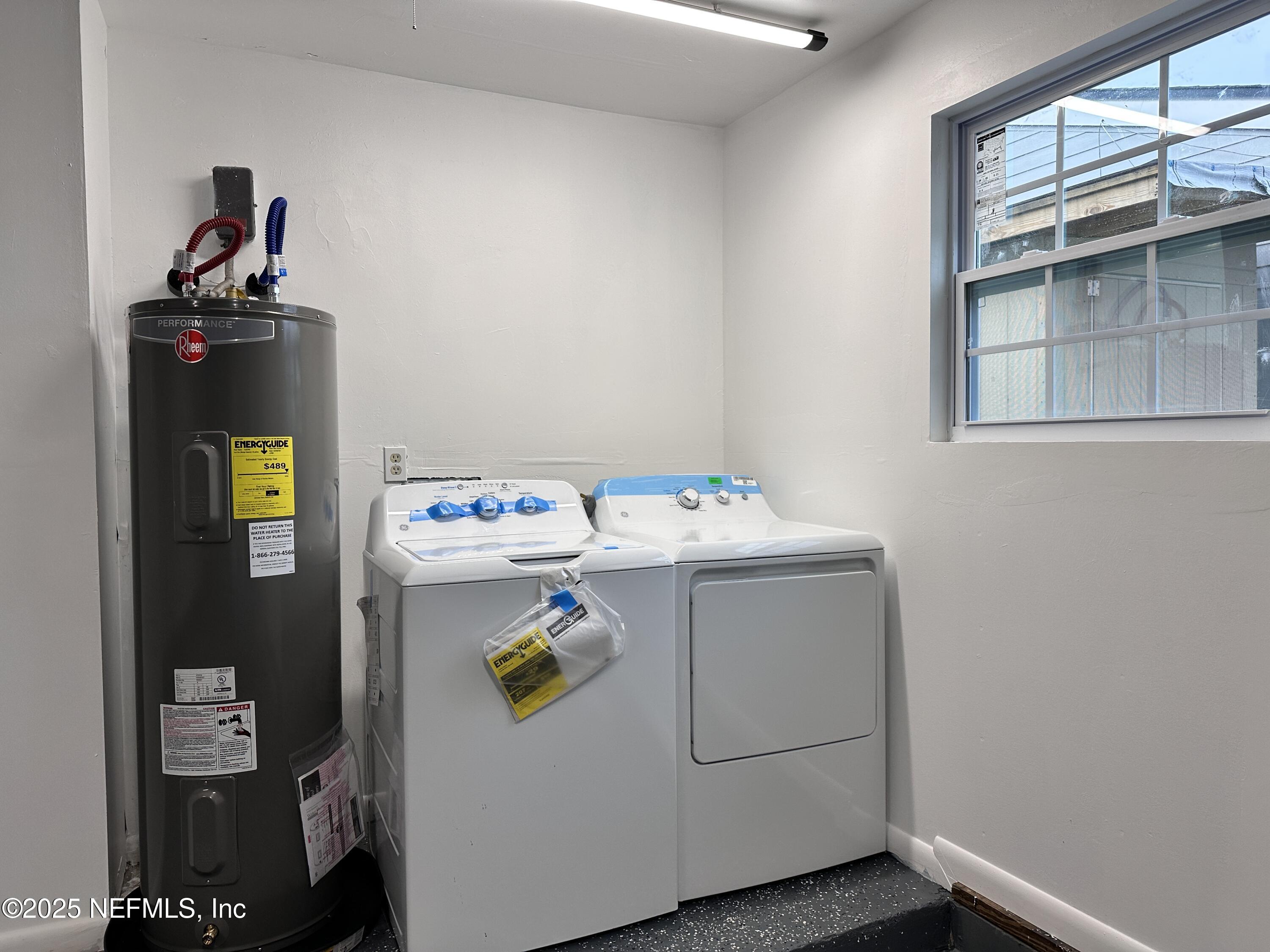 2538 Green Spring Drive Jacksonville, FL 32246 - Photo 13 of 15 a utility room with dryer and washer