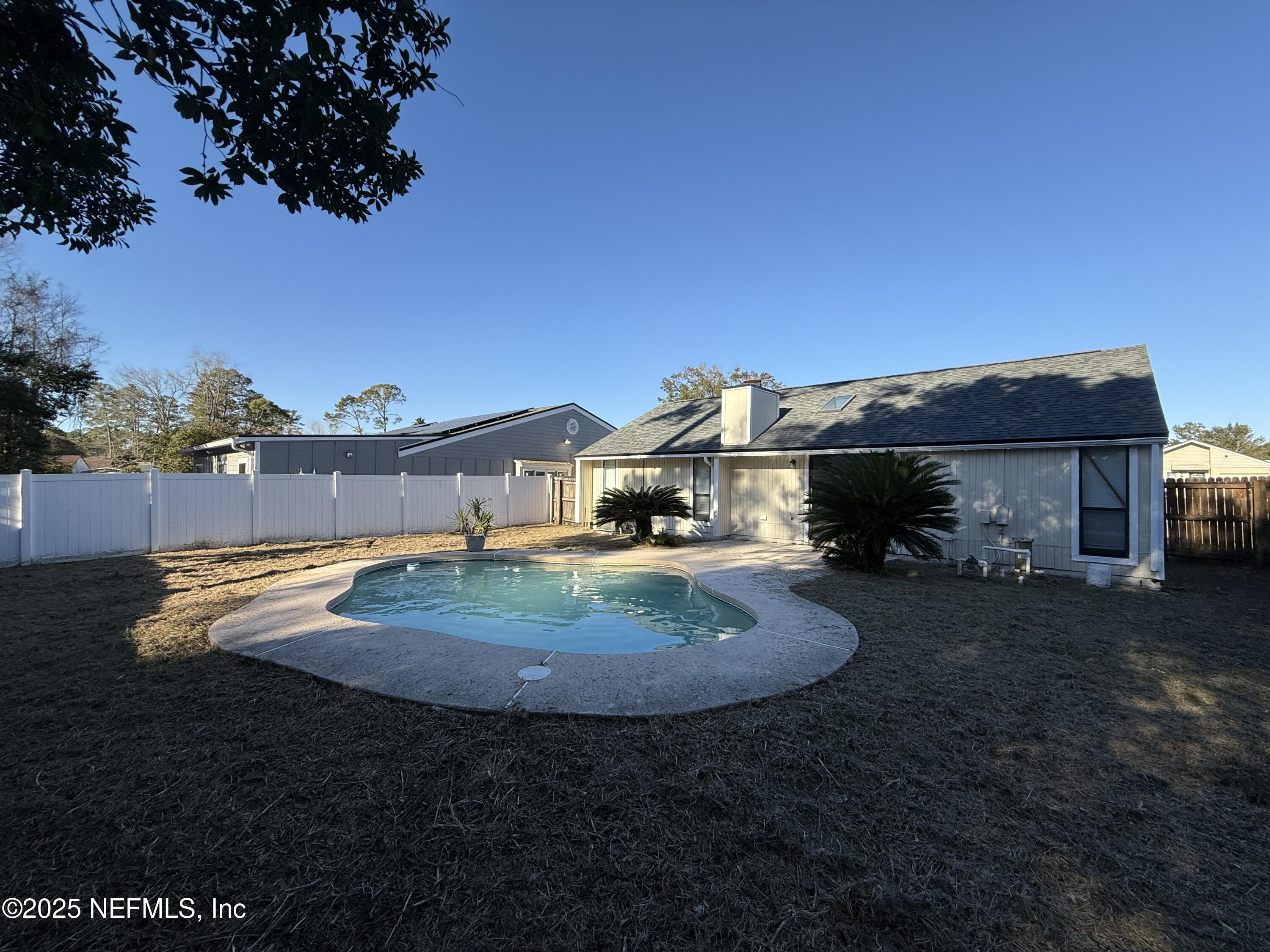 2538 Green Spring Drive Jacksonville, FL 32246 - Photo 14 of 15 a view of a house with a yard