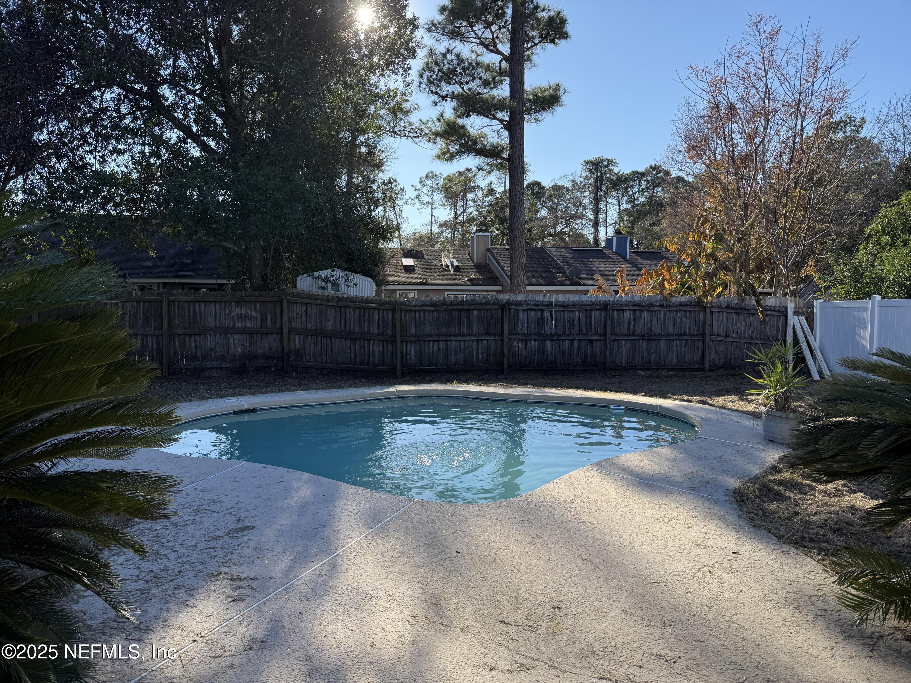 2538 Green Spring Drive Jacksonville, FL 32246 - Photo 15 of 15 a view of backyard with outdoor seating and trees