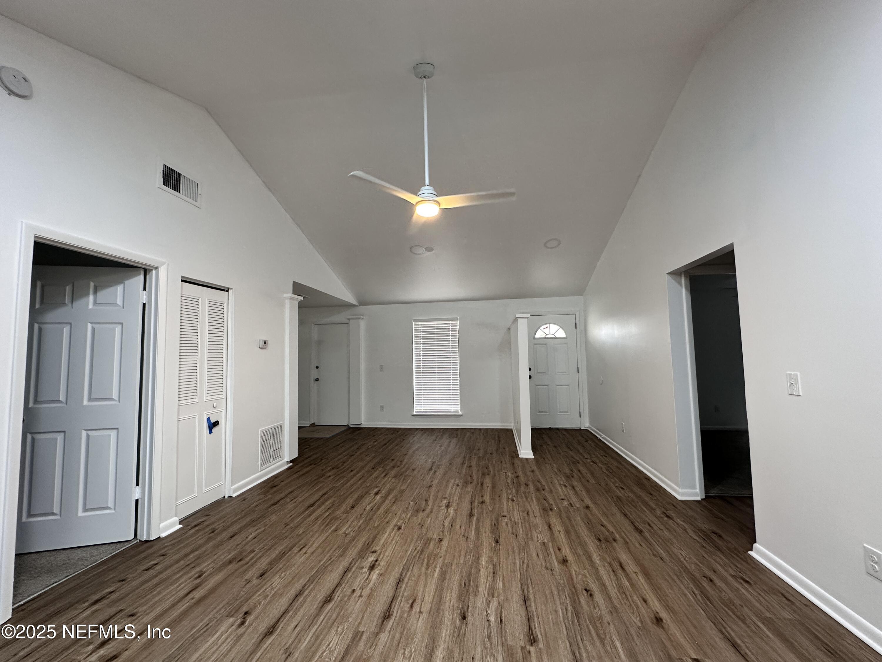 2538 Green Spring Drive Jacksonville, FL 32246 - Photo 3 of 15 a view of a room with wooden floor and window