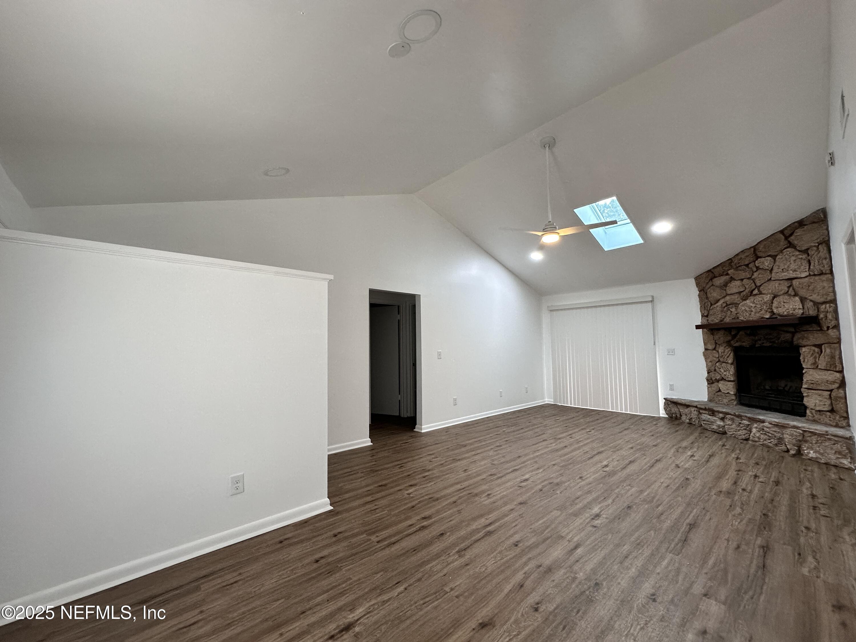 2538 Green Spring Drive Jacksonville, FL 32246 - Photo 4 of 15 wooden floor in an empty room with a fireplace