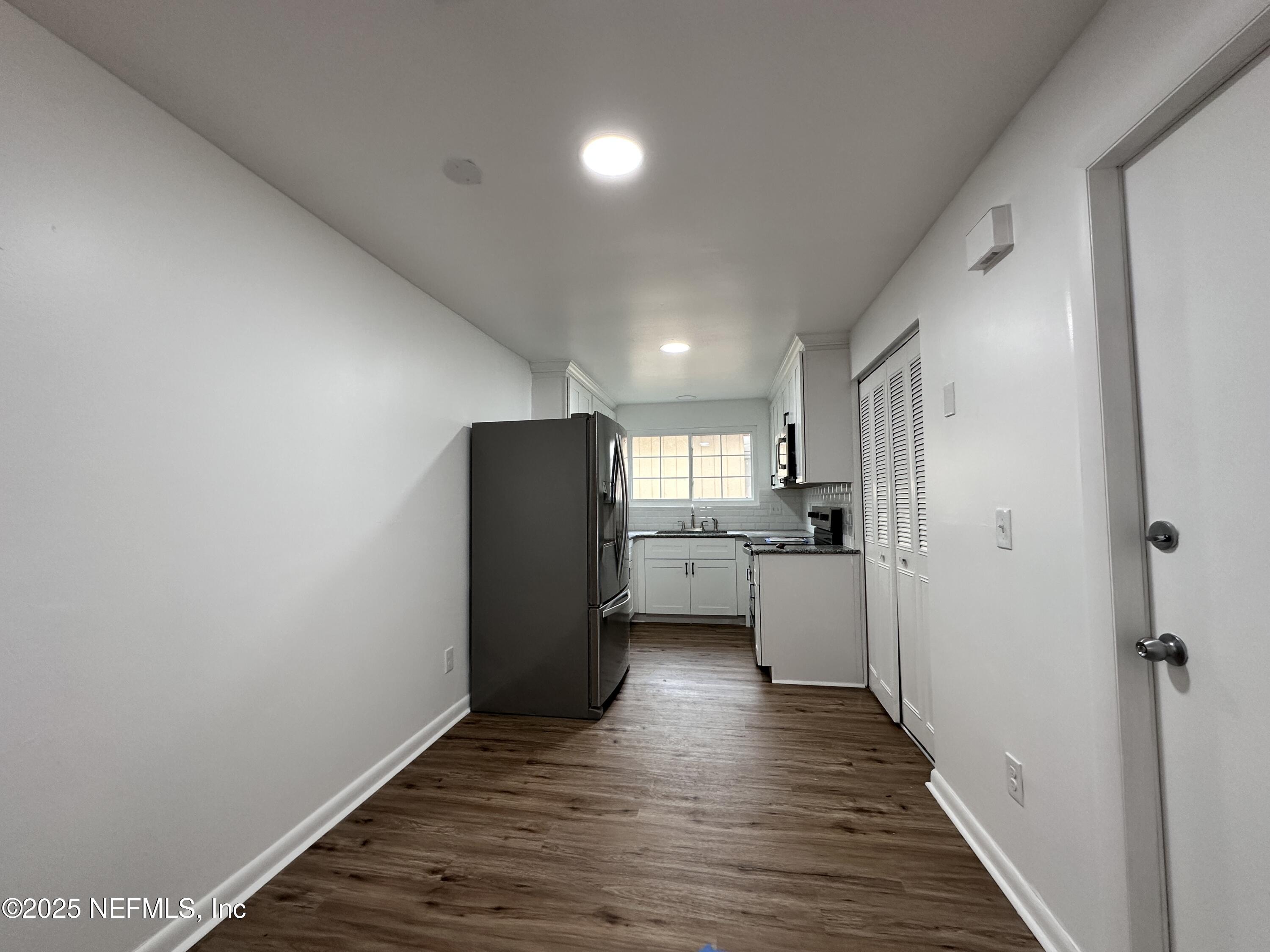 2538 Green Spring Drive Jacksonville, FL 32246 - Photo 5 of 15 a view of a kitchen from a hallway