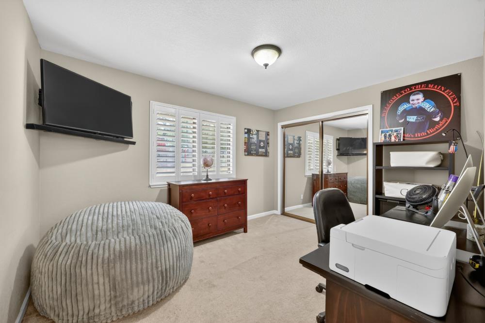 3340 Garden Bar Road Lincoln, CA 95648 - Photo 32 of 56 a bedroom with furniture and a flat screen tv