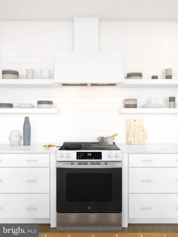 a stove top oven sitting inside of a kitchen