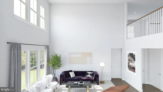 a living room with furniture and large windows