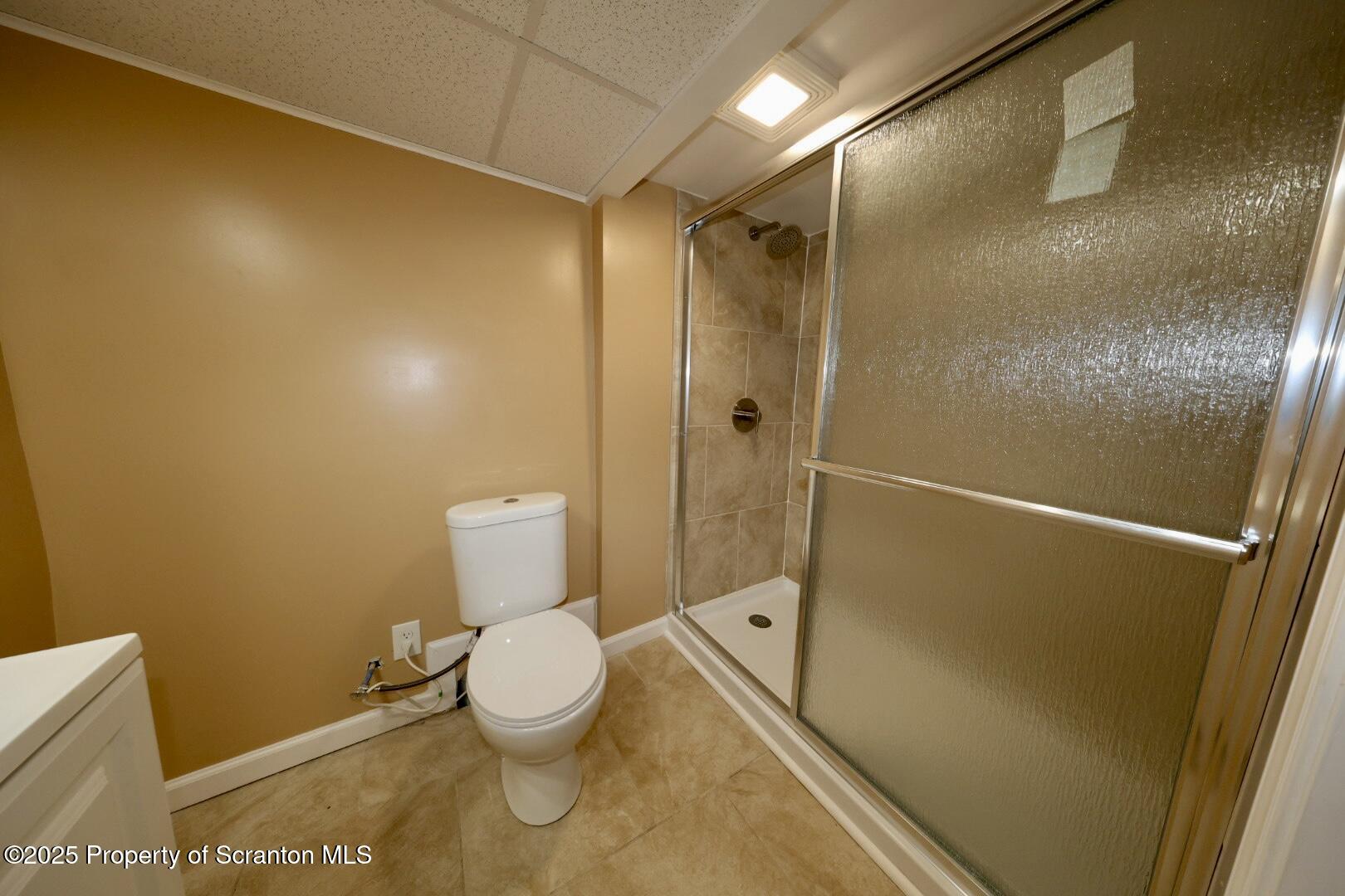 322 1st Street Olyphant, PA 18447 - Photo 5 of 13 a bathroom with a toilet and a shower