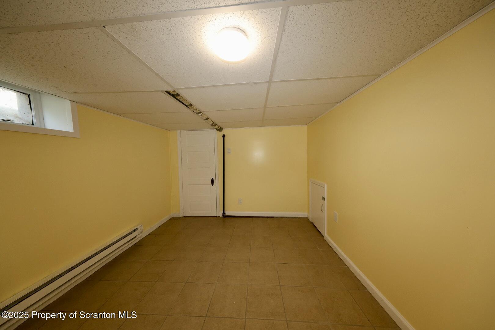 322 1st Street Olyphant, PA 18447 - Photo 9 of 13 a view of a room with a empty space