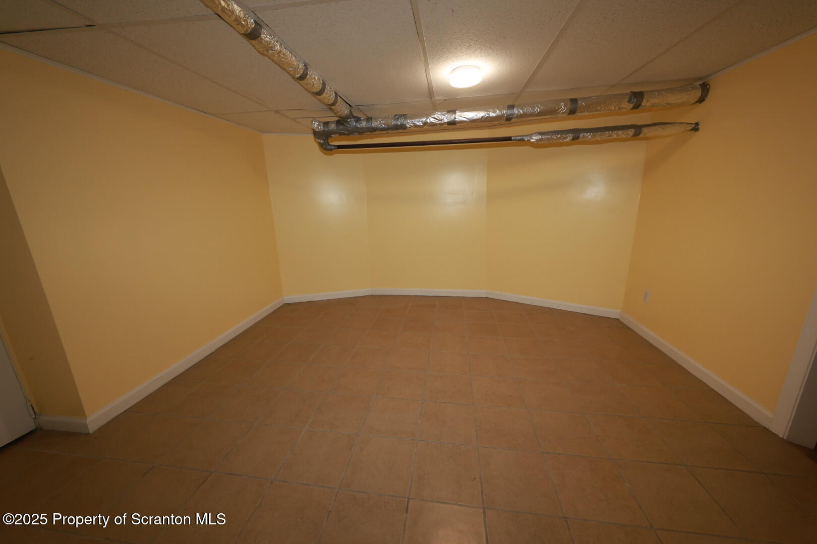 322 1st Street Olyphant, PA 18447 - Photo 10 of 13 a view of a room with racks on the wall