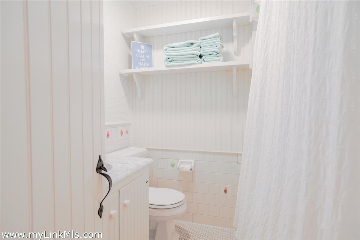 14 & 16 Coffin Street Nantucket, MA 02554 - Photo 14 of 50 a bathroom with a shower and a toilet