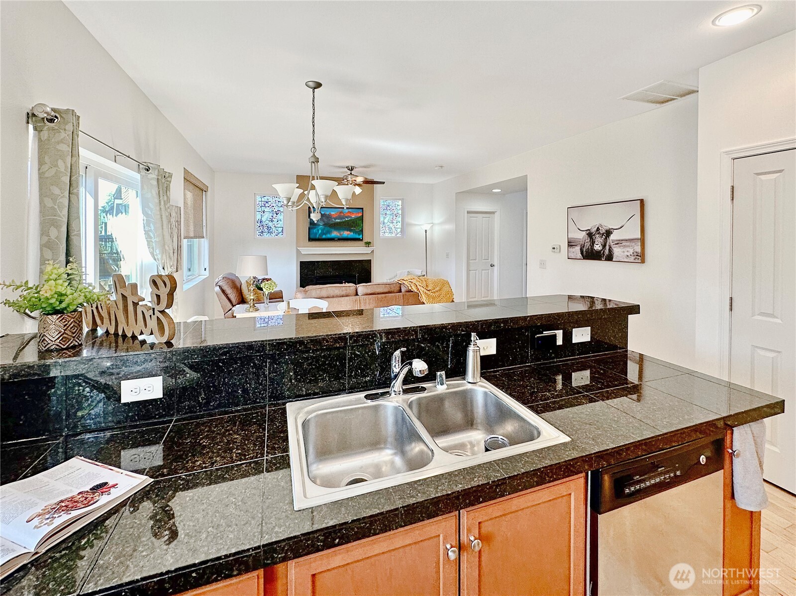 1348 Ebbets Drive Tumwater, WA 98512 - Photo 20 of 37 a kitchen with a sink and a stove