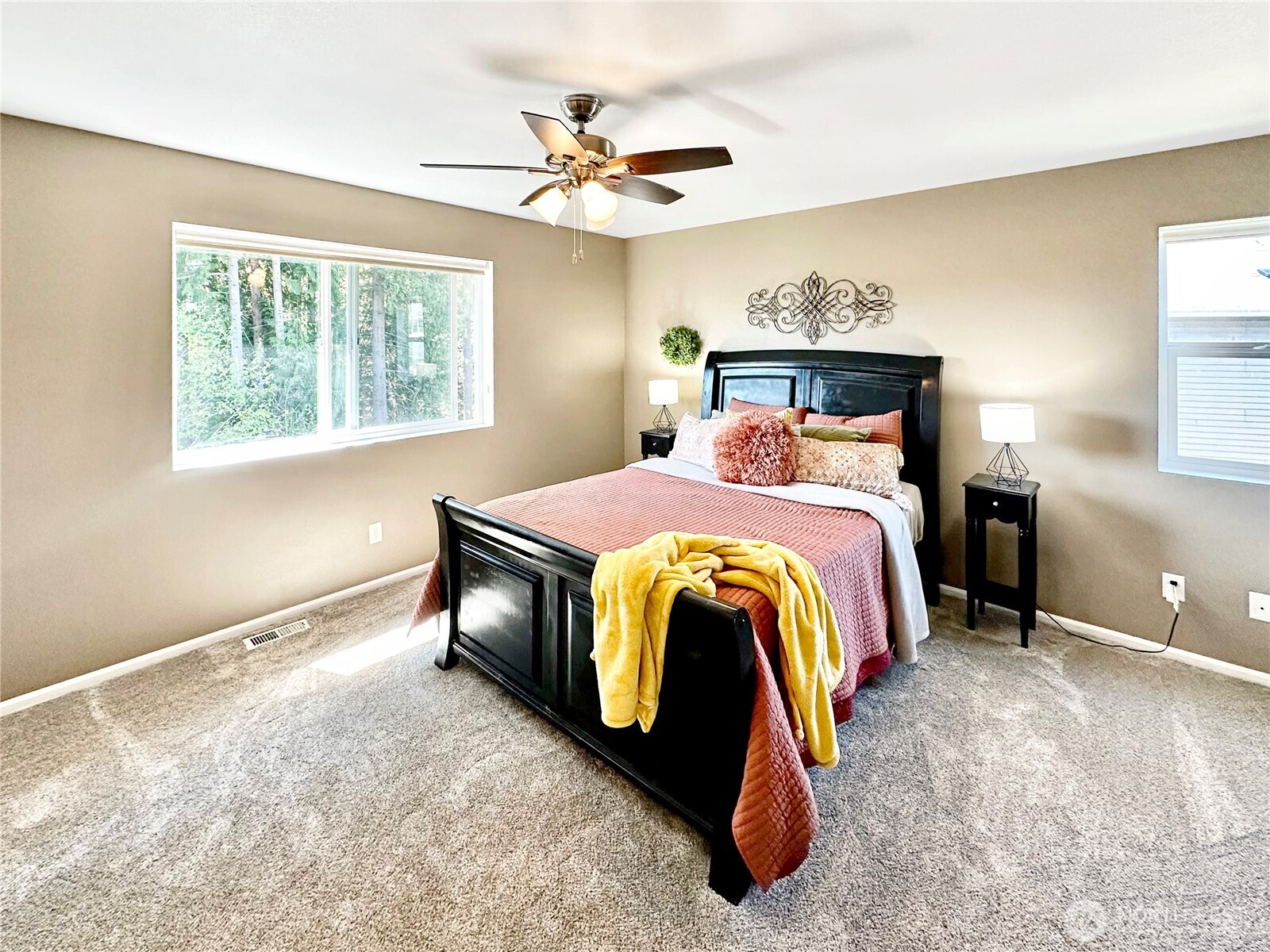 1348 Ebbets Drive Tumwater, WA 98512 - Photo 22 of 37 a bed room with a bed and a chandelier