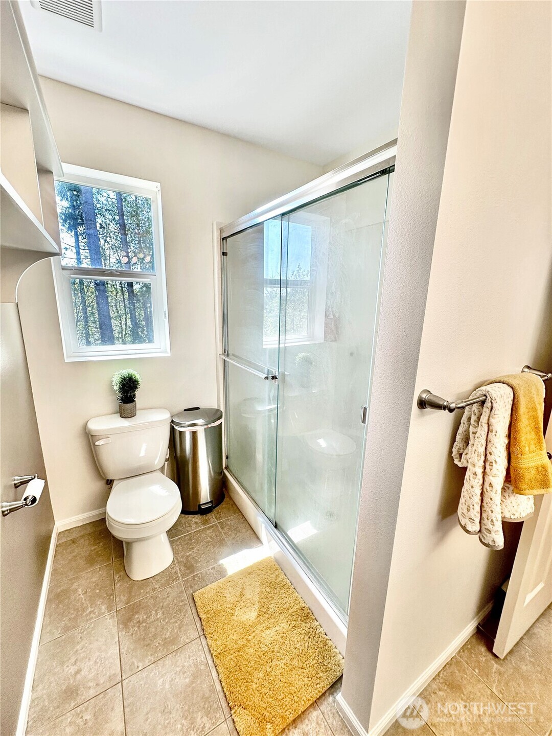 1348 Ebbets Drive Tumwater, WA 98512 - Photo 28 of 37 a bathroom with a toilet sink and a shower