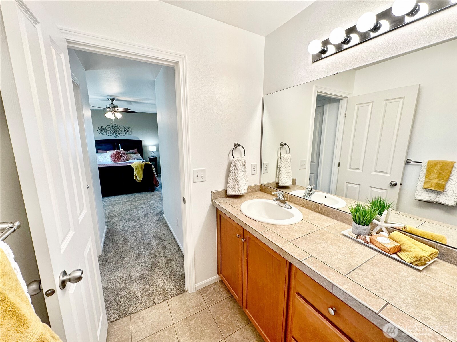 1348 Ebbets Drive Tumwater, WA 98512 - Photo 29 of 37 a bathroom with a sink double vanity and a mirror